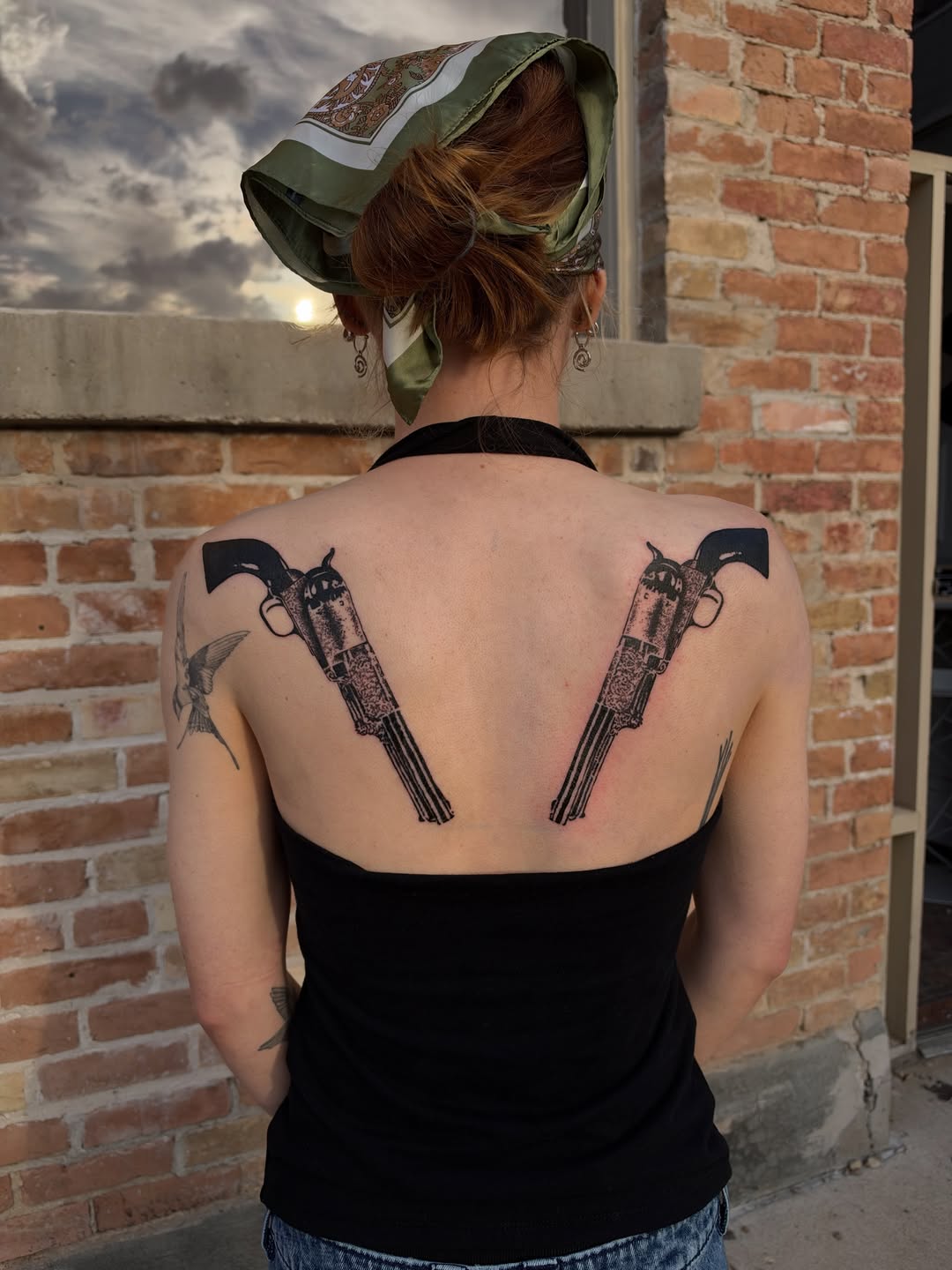 Western pistols tattoo by Rose Hayes